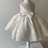 Ivory baby party dress with bow and lace embroidery for infants and toddlers