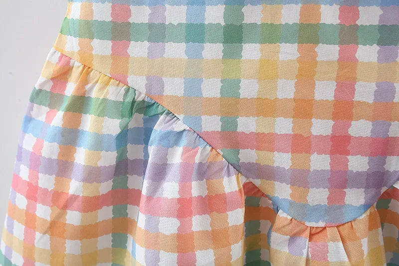 baby party dress with multicolor pastel checkered pattern and ruffle detail