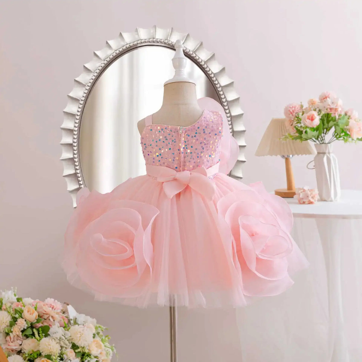baby pink party dress with sequin bodice and large floral tutu skirt for infants