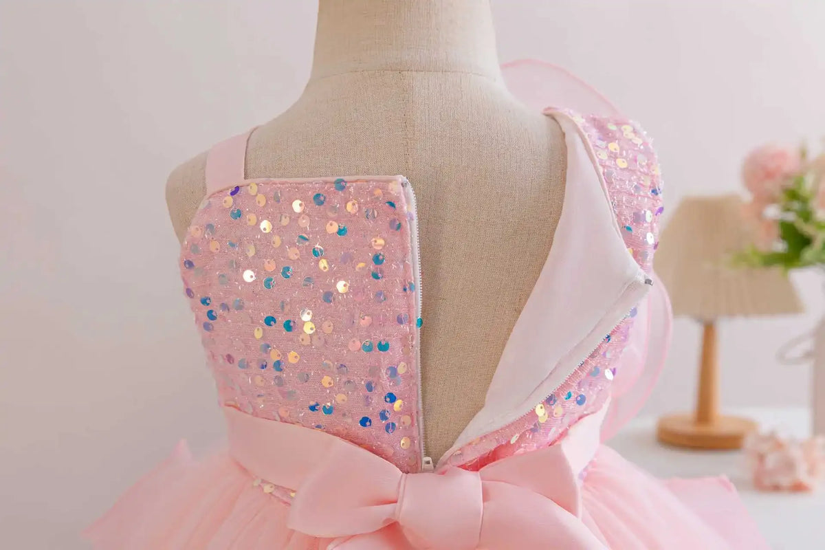 toddler pink party dress with sequin straps and bow detail on back