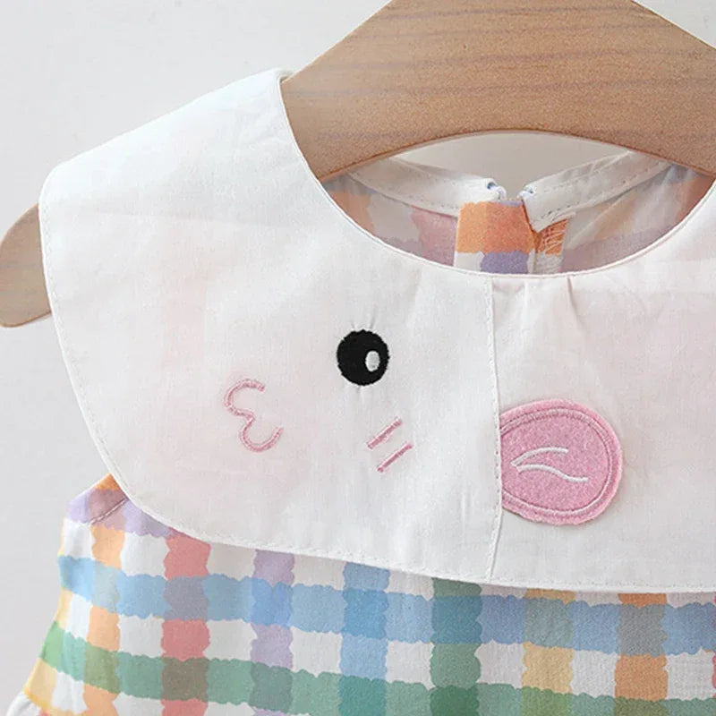 baby party dress with white collar featuring embroidered cute animal face detail and multicolor checkered pattern