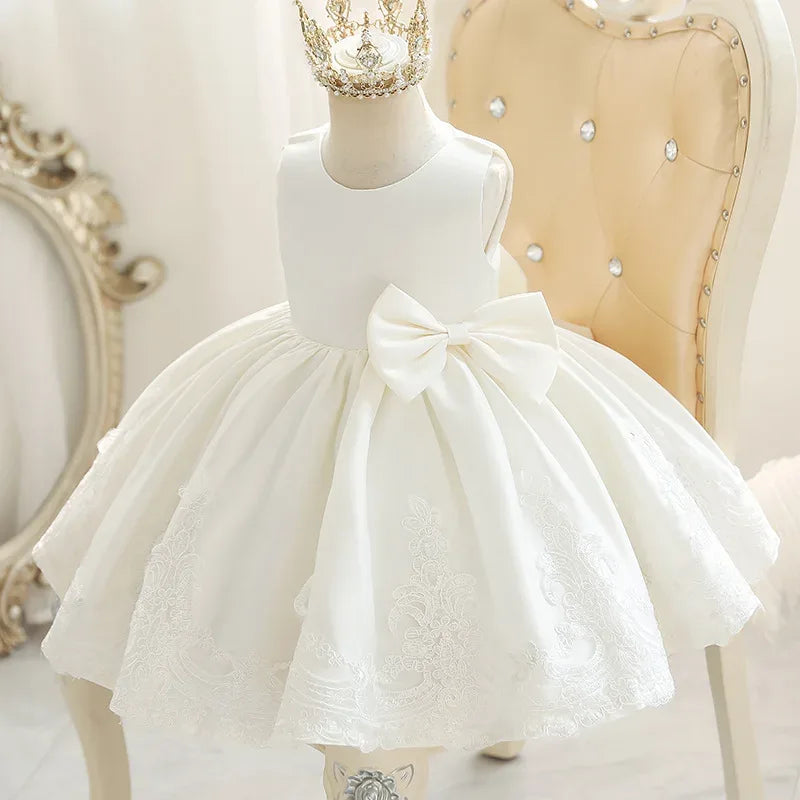 White baby party dress with large bow and embroidered skirt for infants and toddlers