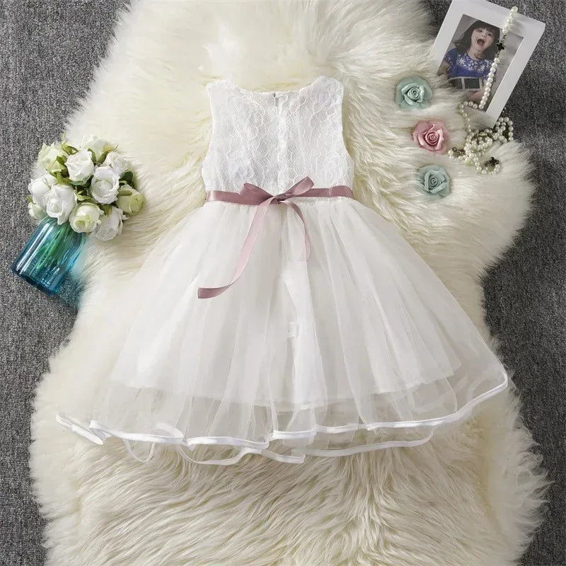 White lace and tulle girls party dress with pink ribbon sash for toddlers and kids