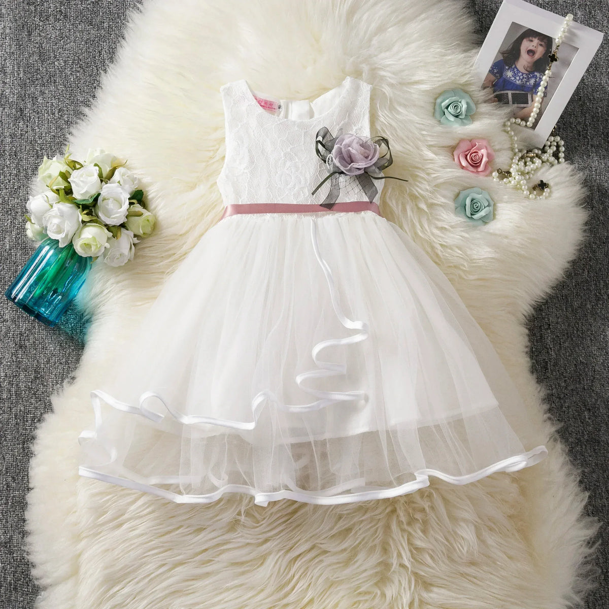 White party dress for girls with pink ribbon waist and flower applique, toddler size