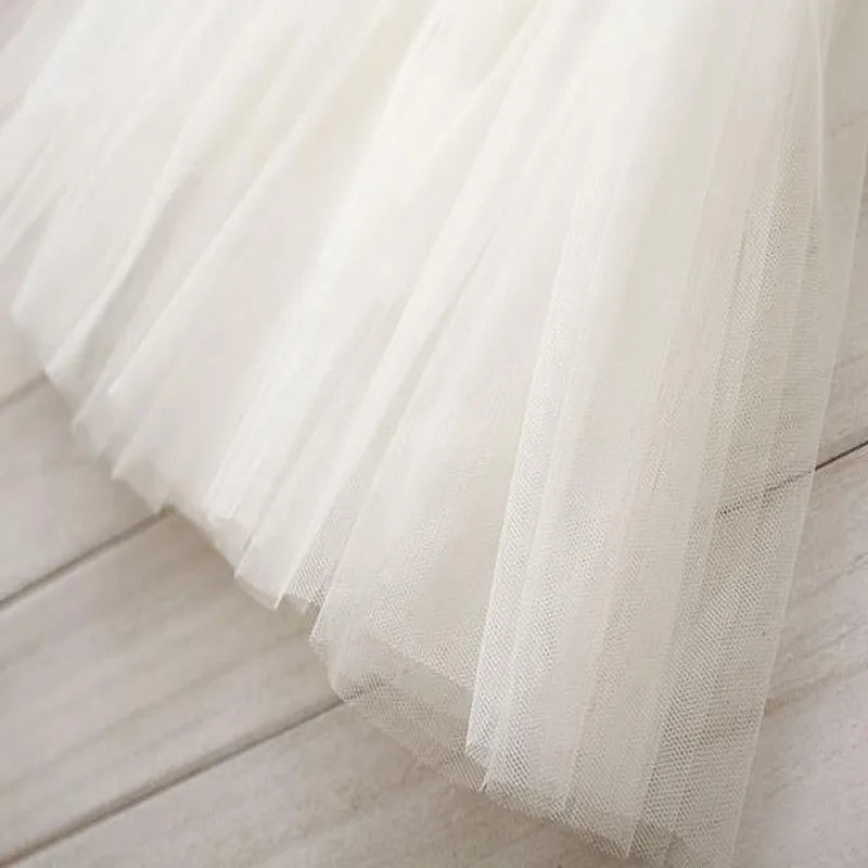 close-up of white girls party dress tulle skirt for toddlers