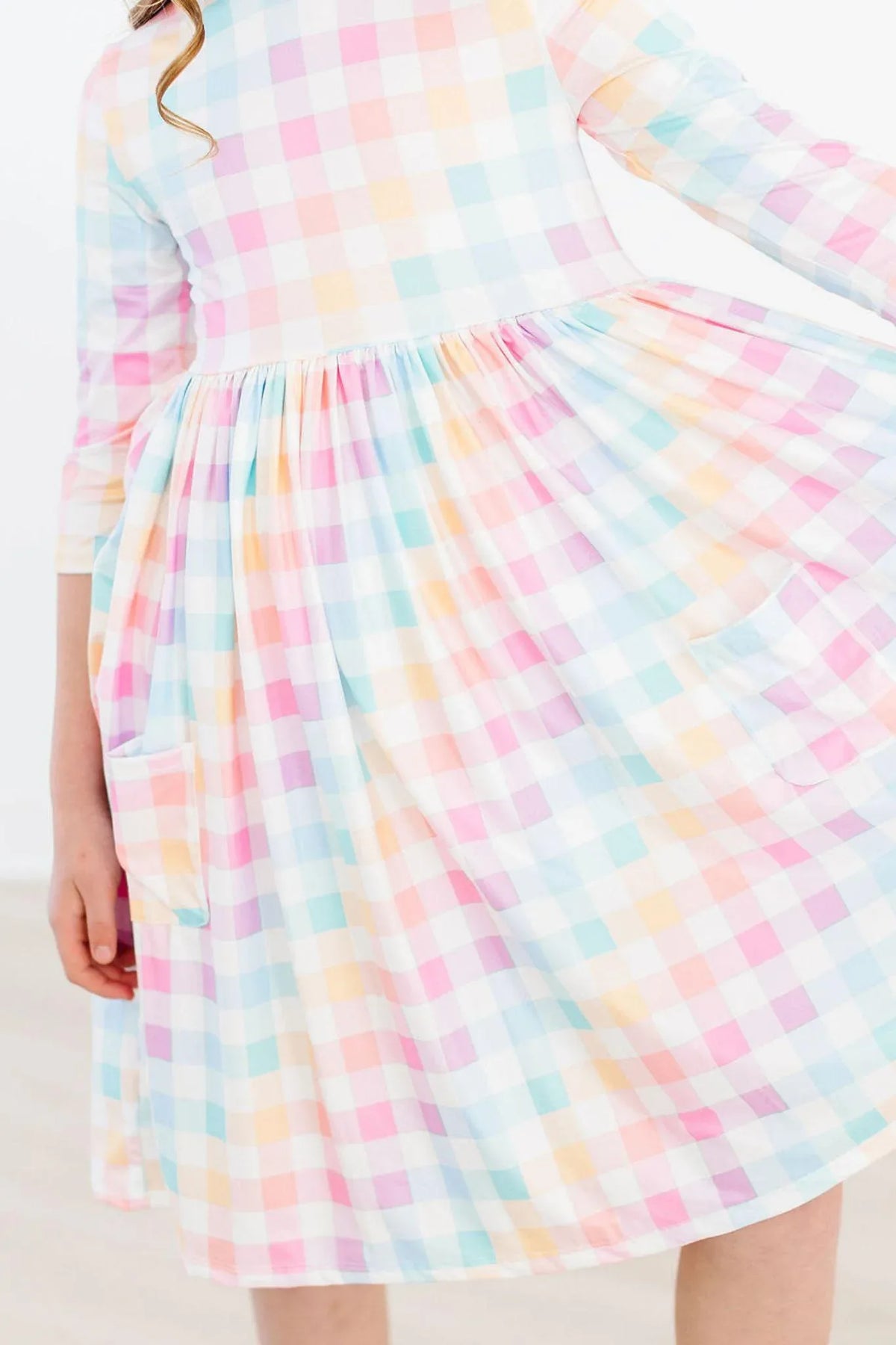 Pastel plaid girls twirl dress by Mila & Rose with 3/4 sleeves and pocket detail for kids