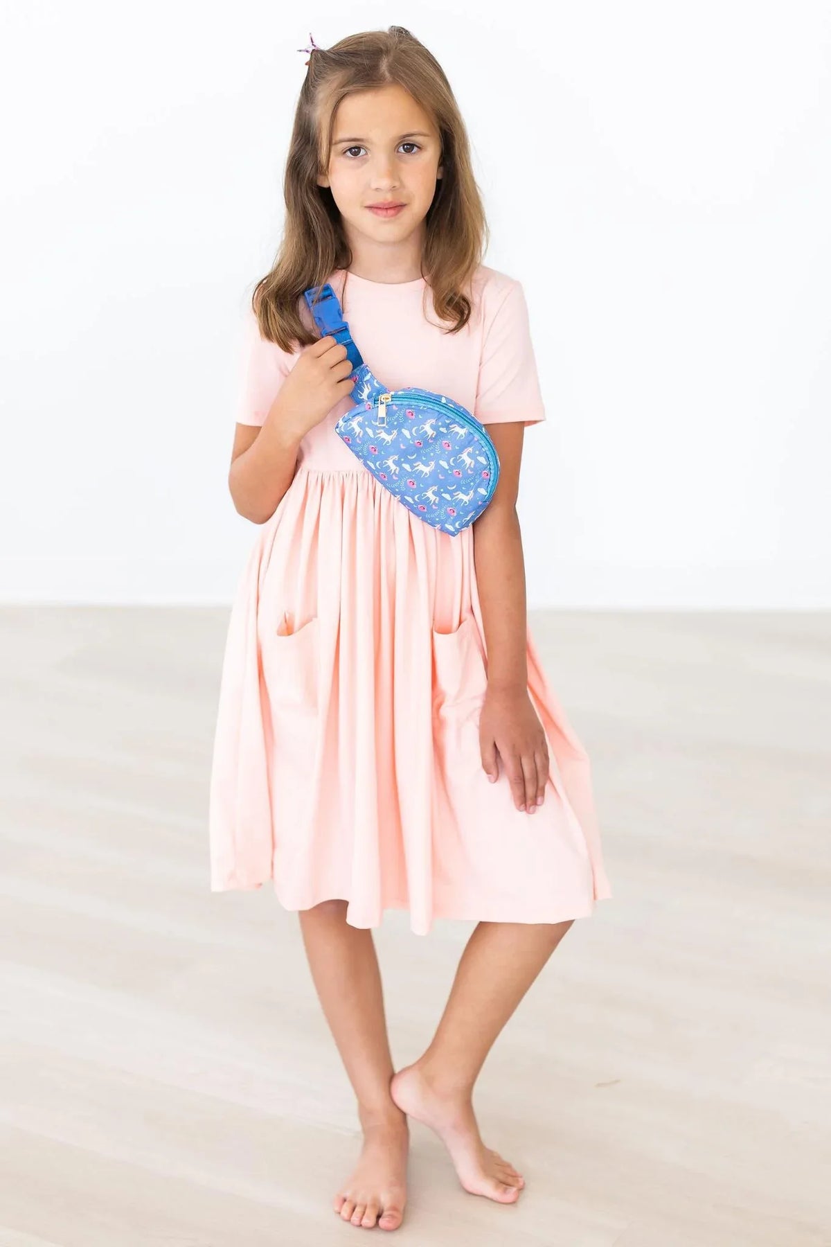 Peach twirl dress for girls by Mila & Rose with short sleeves and pockets, knee-length