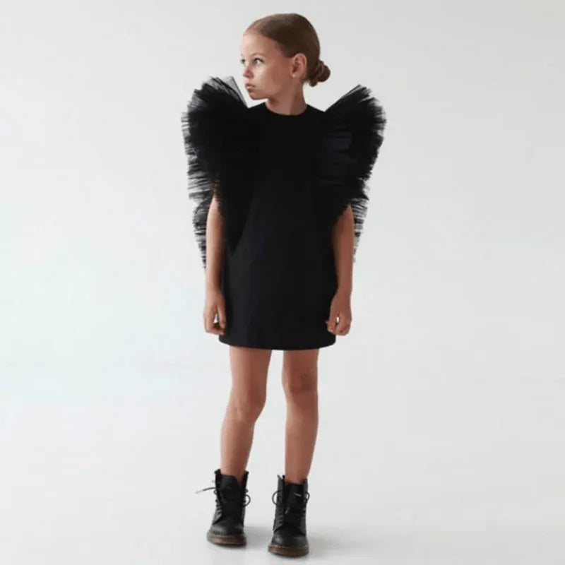 Girls black party dress with dramatic tulle puff sleeves for ages 4 to 6