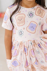 Girls peanut butter jelly dress for girls with short sleeves and twirl pocket design in pastel colors