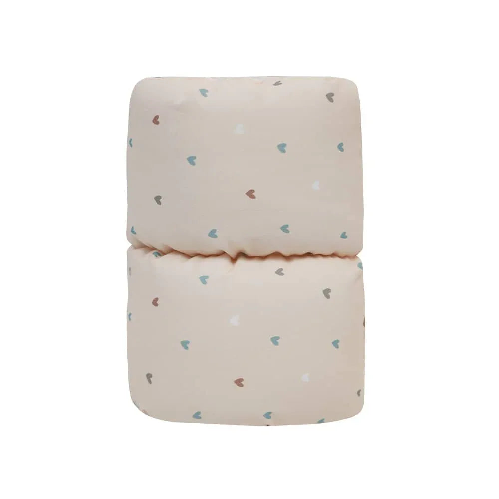 Beige cotton nursing pillow for babies with small multicolor heart prints by Goosewaddle