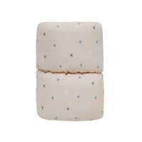 Beige cotton nursing pillow for babies with small multicolor heart prints by Goosewaddle