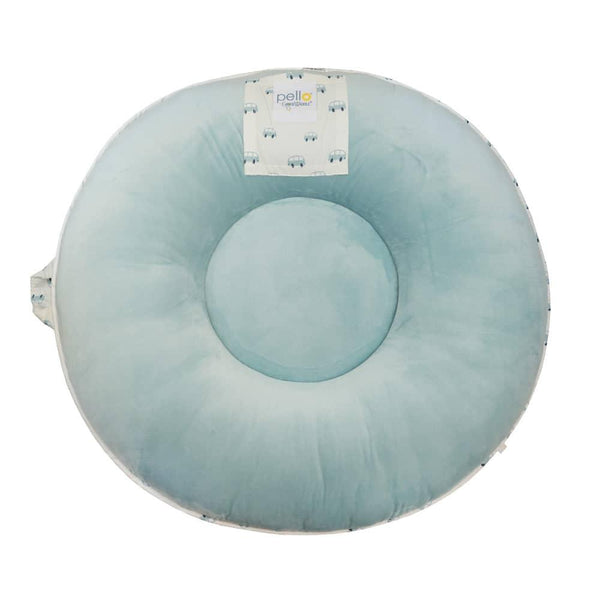 Light blue round toddler floor cushion made of soft fabric with small patterned details