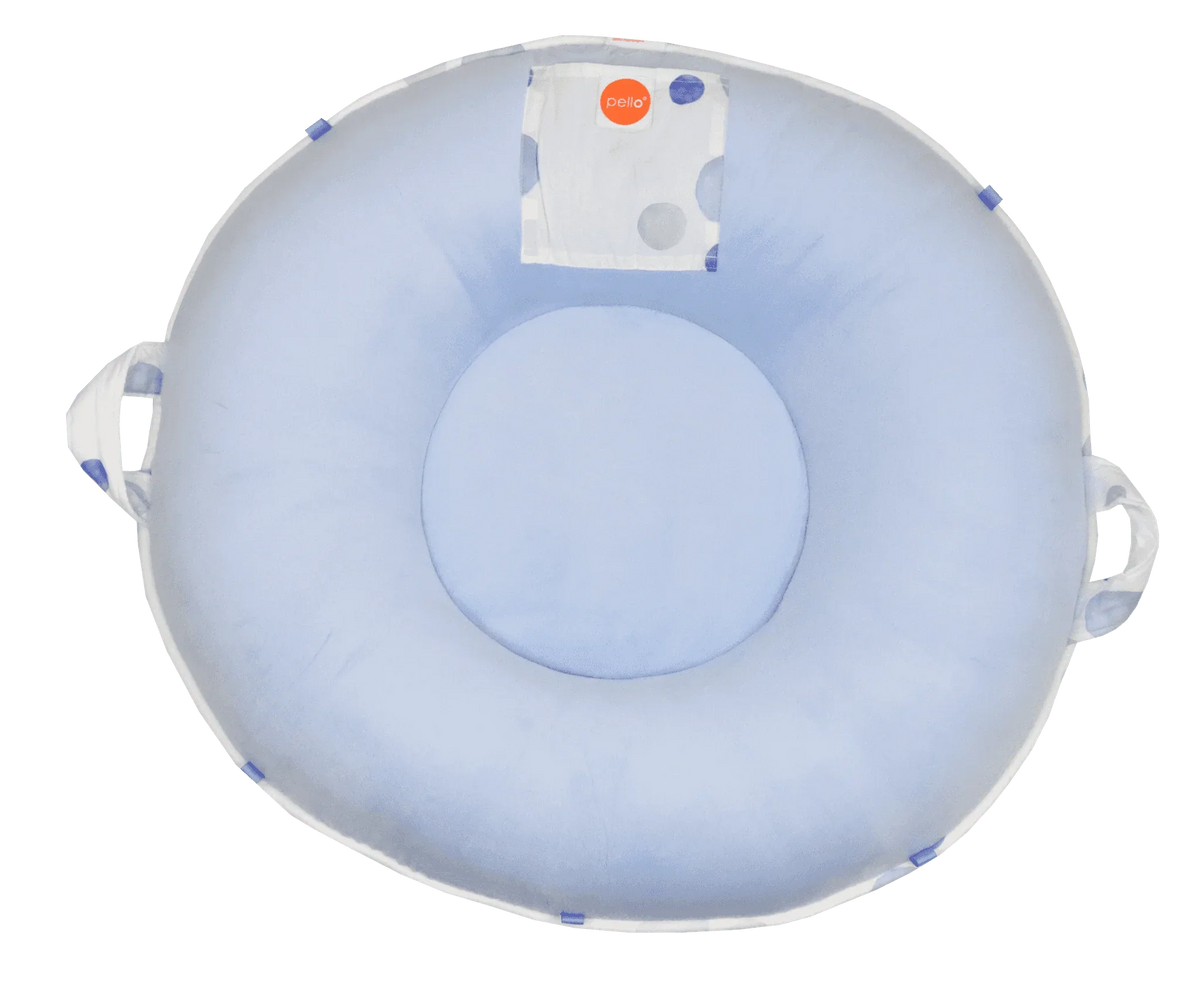 Light blue cotton toddler floor cushion with round shape and side handles for easy carrying