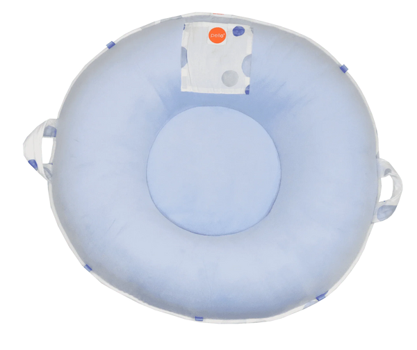 Light blue cotton toddler floor cushion with round shape and side handles for easy carrying