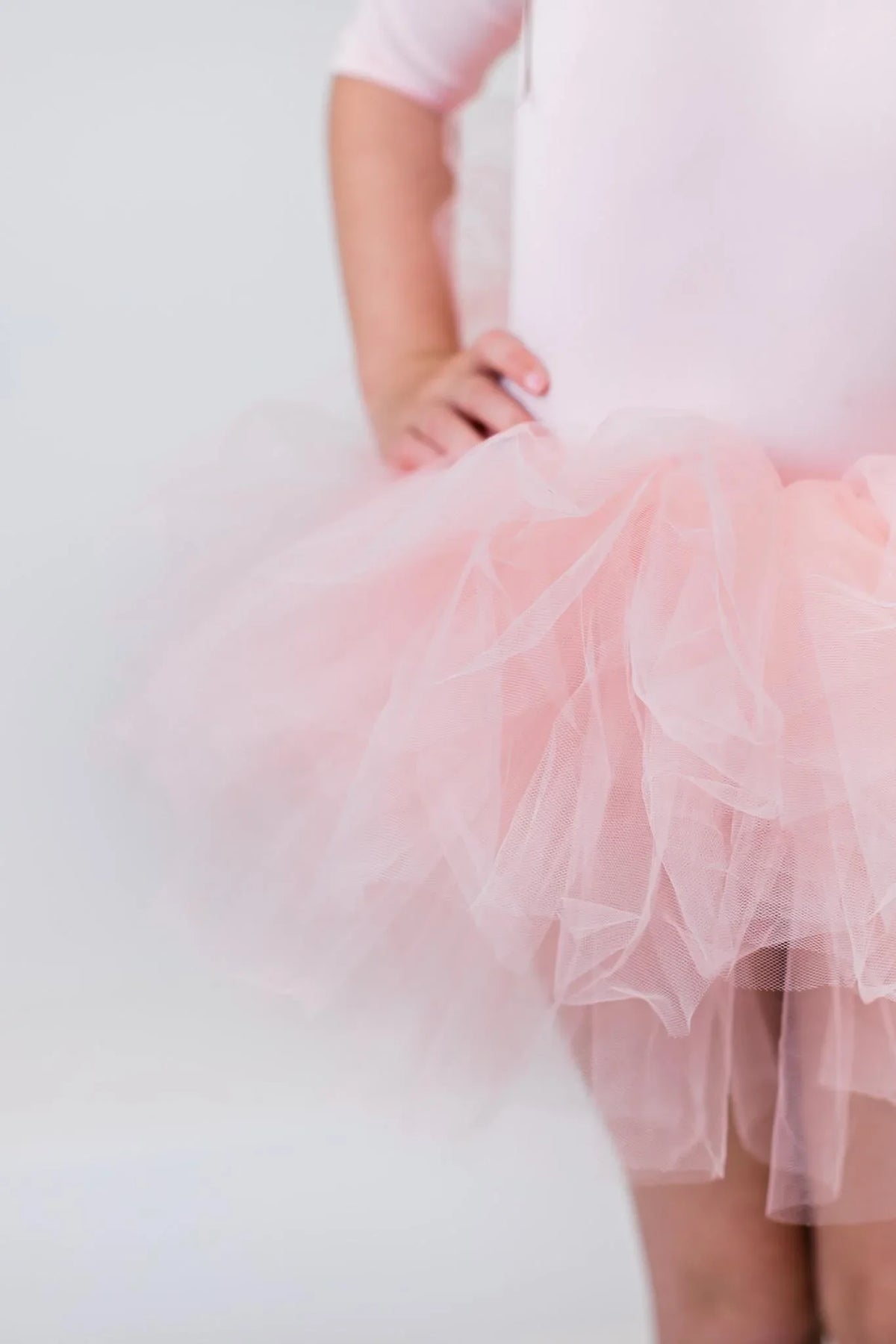 Pink ballet leotard for girls with 3/4 sleeves and fluffy tutu skirt in toddler size