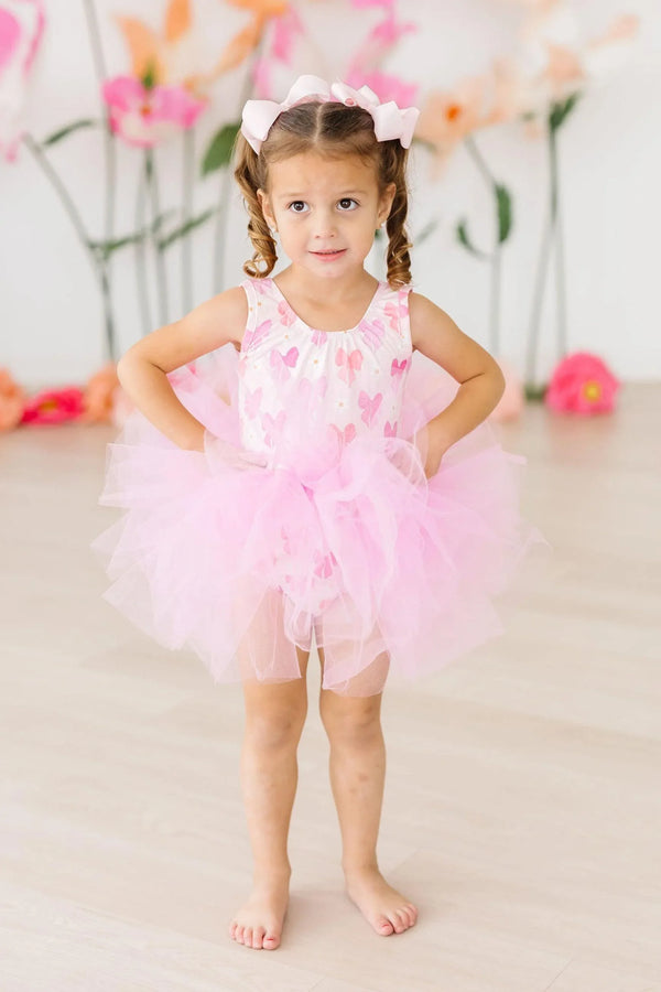 Girls pink bow print tutu leotard for girls by Mila Rose, sleeveless with fluffy tulle skirt
