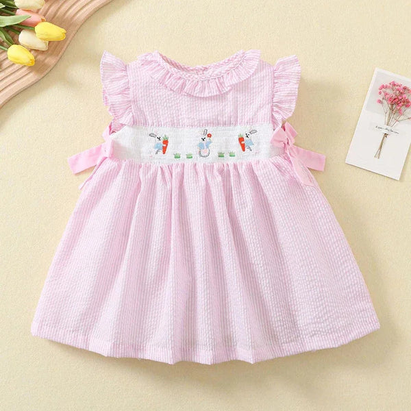 baby girls pink party dress with ruffle sleeves and embroidered bunny and carrot detail