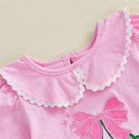 Soft cotton pink embroidered baby bubble romper with scalloped collar and bow detail