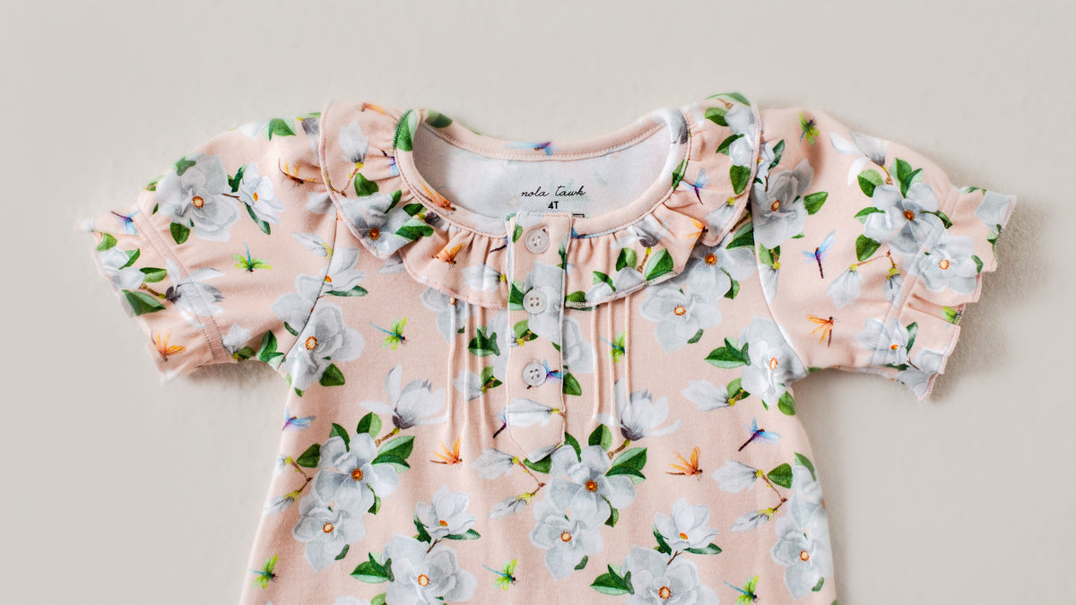 Floral dress with ruffled details on a light background