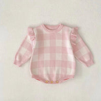 pink plaid baby romper for infants with long sleeves and ruffle details on shoulders