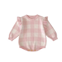 pink plaid baby romper for infants with ruffle sleeves and button closure at bottom