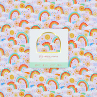 Packaging of The Forever Swaddle Blanket - Here Comes the Sunshine (Pink) showcasing the vibrant rainbow design and brand logo of Raising Mama, highlighting its cheerful and nurturing theme.