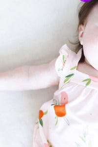 baby girl pink romper ruffle with cross back and orange fruit print sleeveless