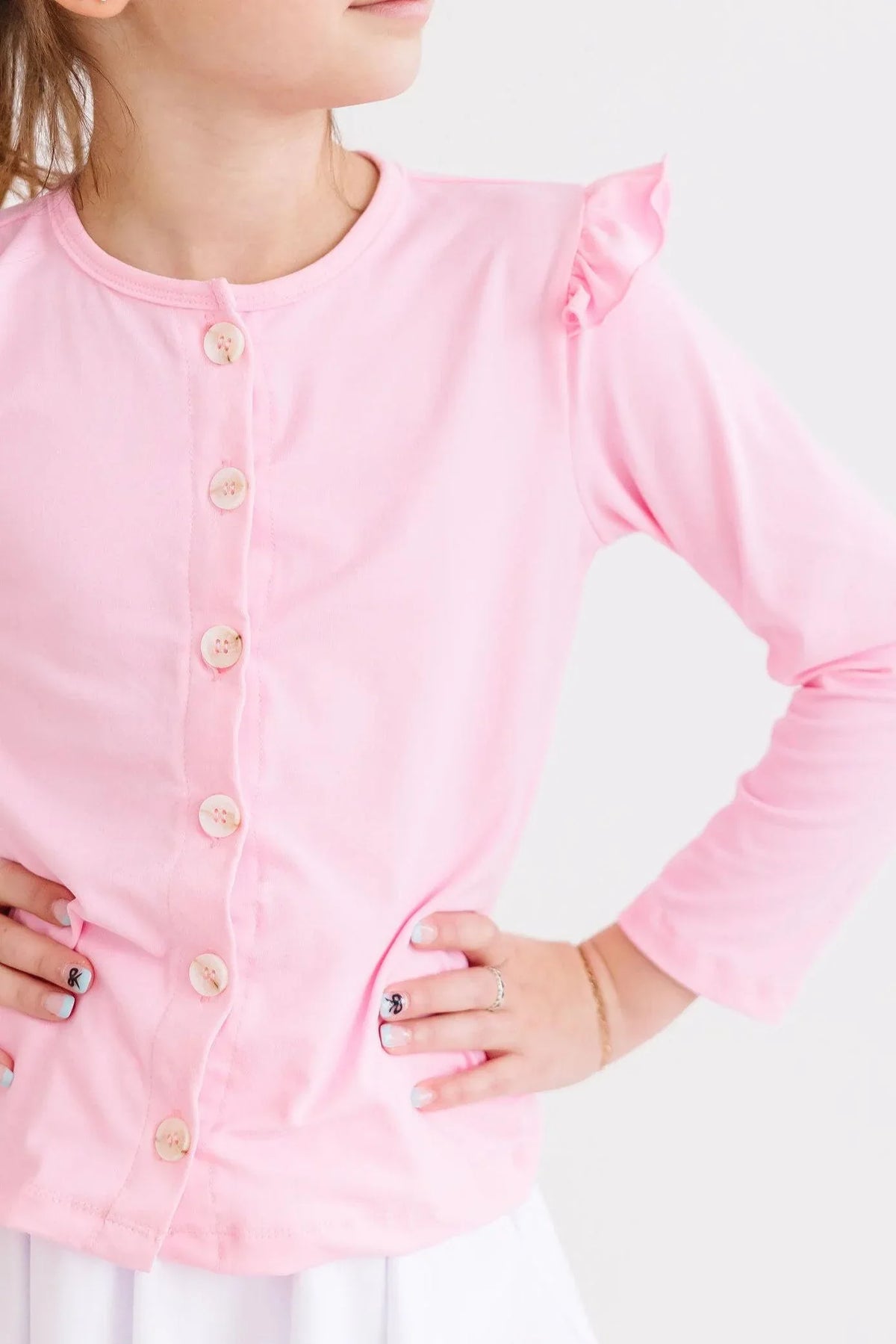 Girls pink long sleeve ruffle cardigan with buttons from Mila and Rose