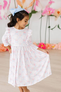Girls pink ruffle twirl dress for girls with 3/4 sleeves and floral pattern