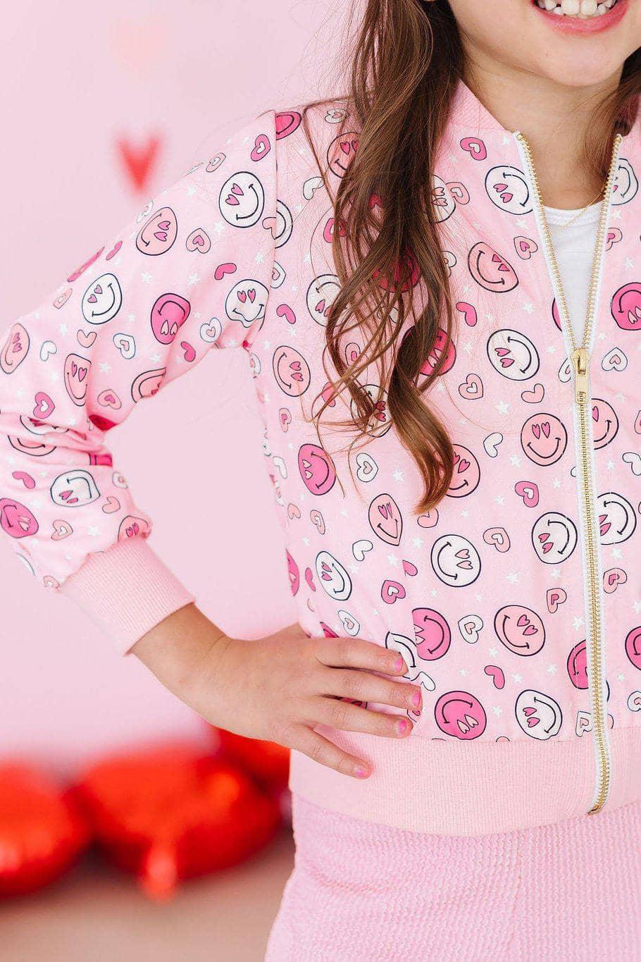 Girls pink Mila & Rose satin jacket with smiley face and heart prints, long sleeve zipper closure