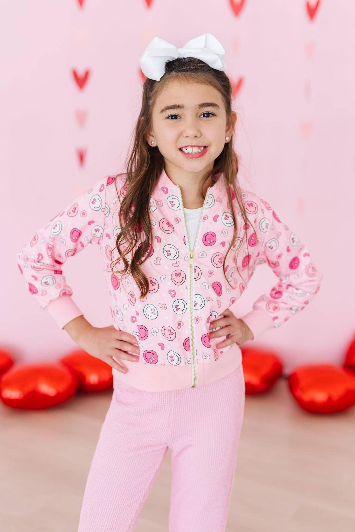 Girls pink satin jacket with colorful smiley face print and front zipper by Mila & Rose