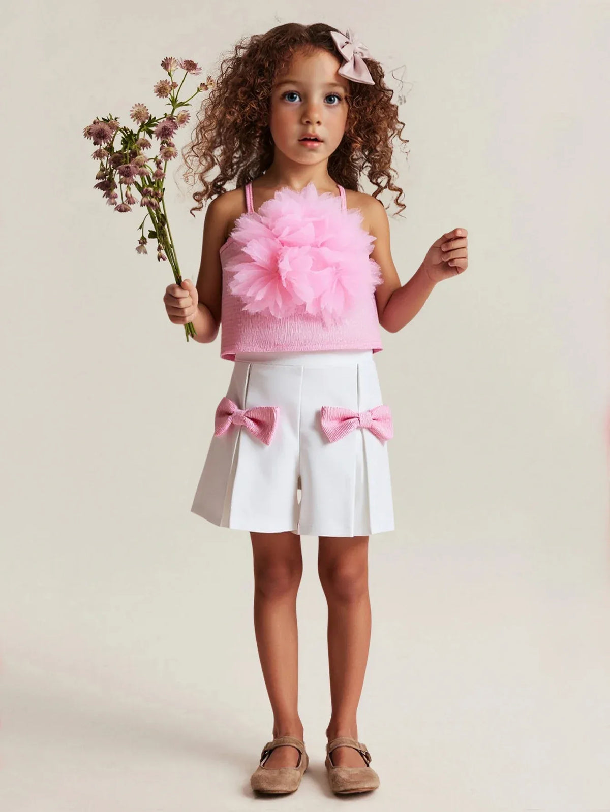 toddler girls pink shorts set with floral top and white shorts featuring pink bows