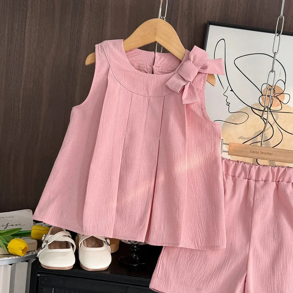 baby pink shorts set with sleeveless top and bow detail suitable for infants