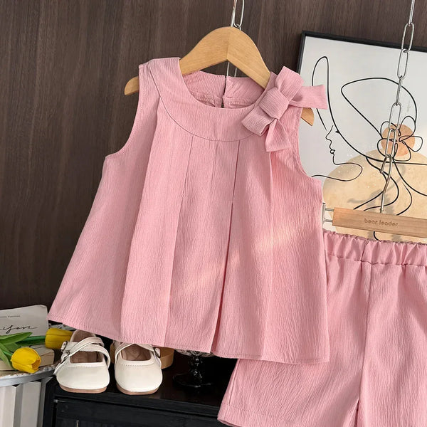 baby pink shorts set with sleeveless top and bow detail suitable for infants