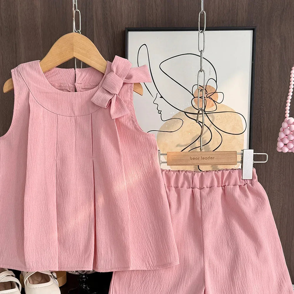 baby pink shorts set with sleeveless top and bow detail for infants