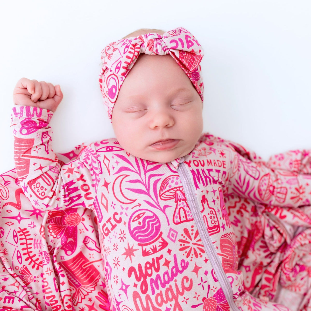 A playful setup of The Second-Skin Bamboo Zippered Footie | Mystic Mama, perfect for ensuring baby comfort on every adventure.