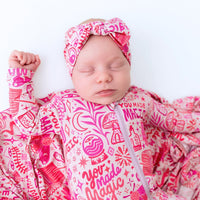 A playful setup of The Second-Skin Bamboo Zippered Footie | Mystic Mama, perfect for ensuring baby comfort on every adventure.