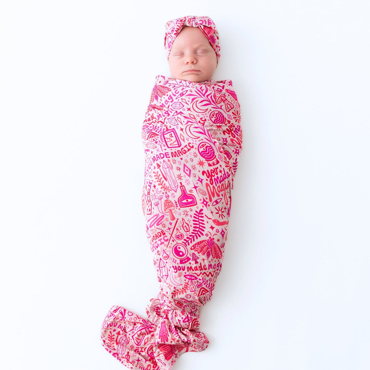 The Forever Large Swaddle Blanket | Mystic Mama in pink, a versatile large swaddle blanket made of soft bamboo blend.