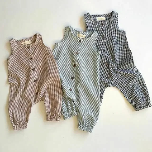 Plaid infant jumpsuit in brown, gray, and black colors with sleeveless design and button front for babies