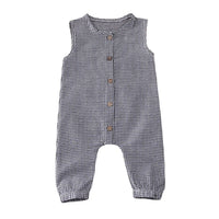 Sleeveless black and white plaid infant jumpsuit with wooden buttons for babies
