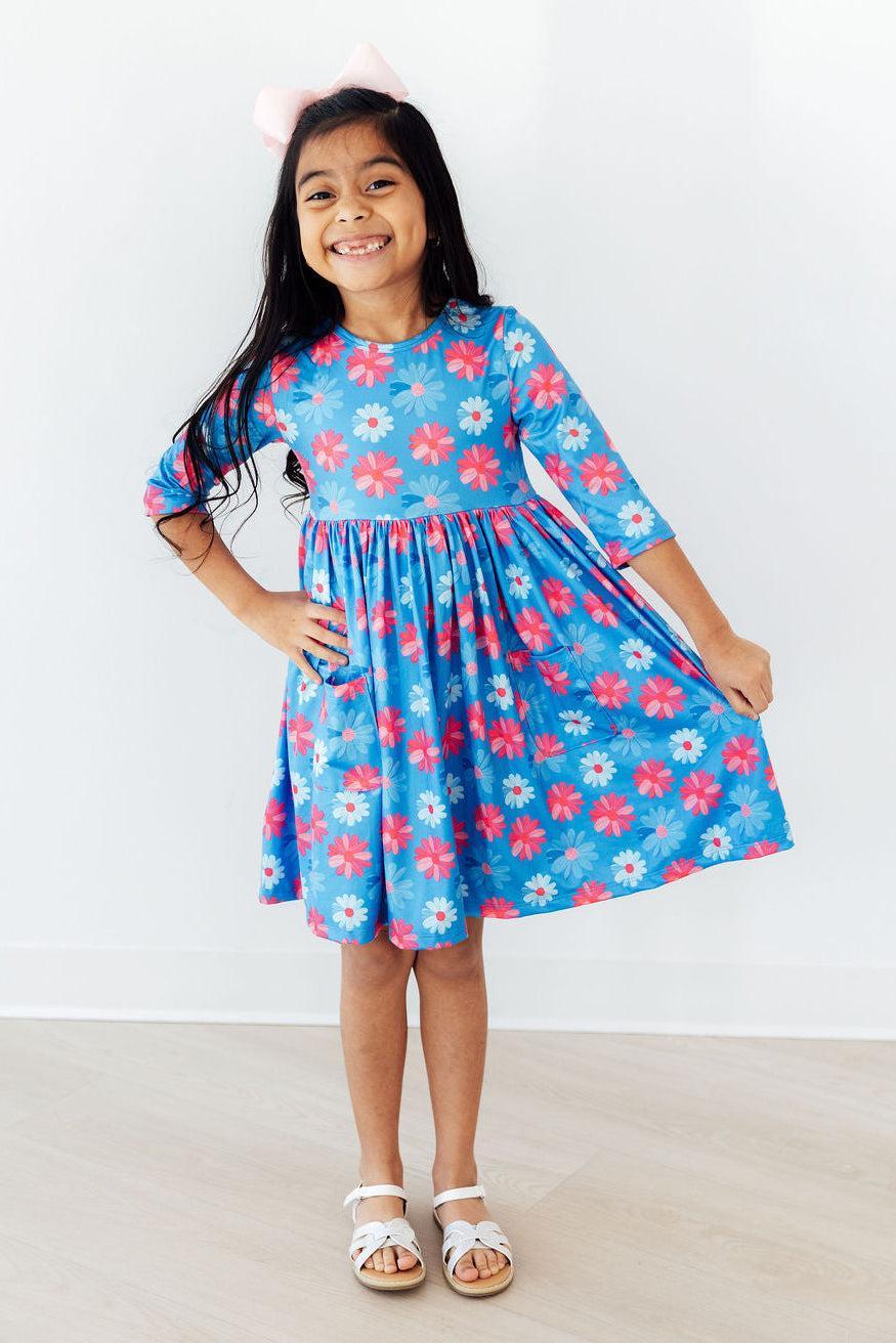 Girls blue pocket dress with pink and white floral print and 3/4 sleeves by Mila & Rose
