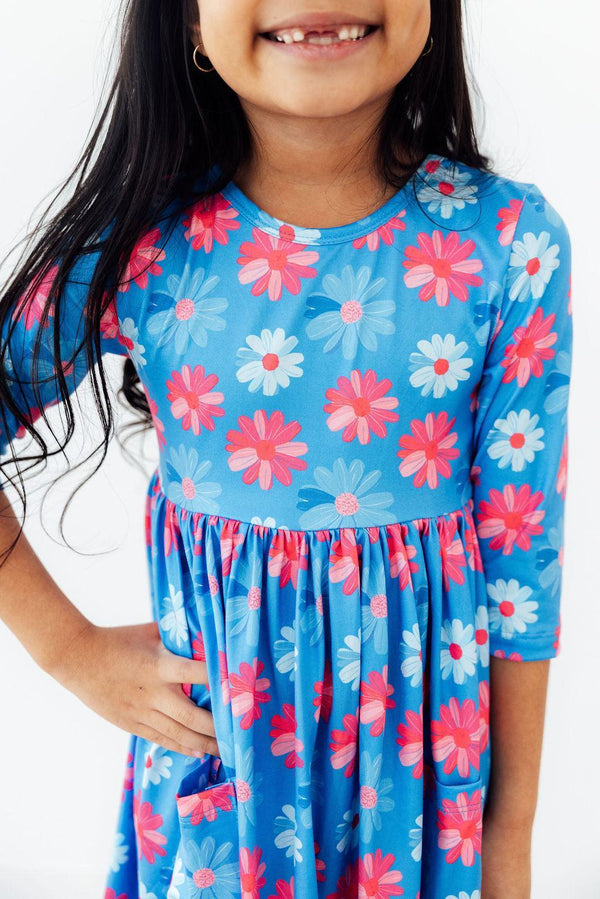 Girls blue pocket dress with pink and white floral print and 3/4 sleeves by Mila & Rose