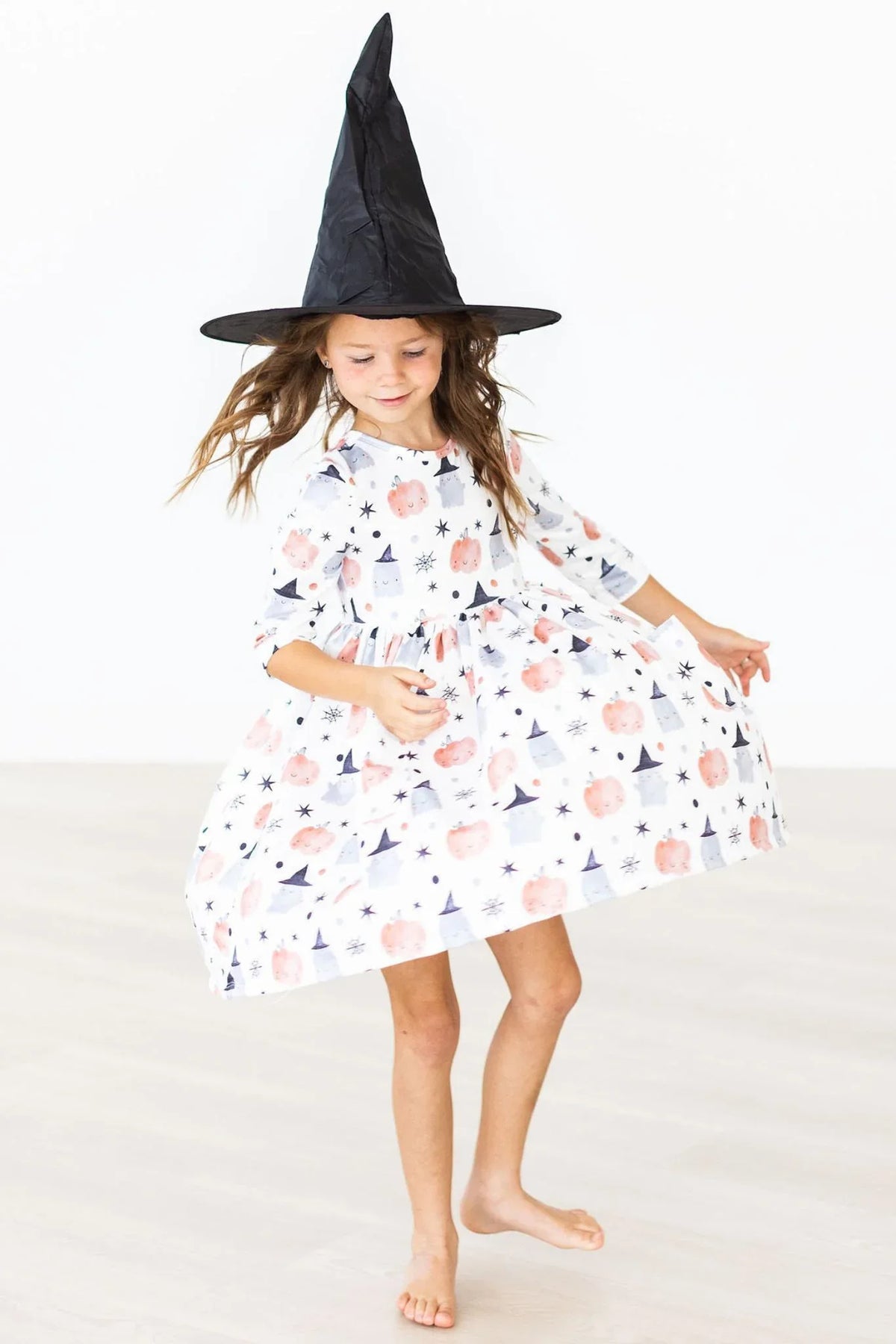 Girls white twirl pocket dress with sleeves and Halloween pumpkin print