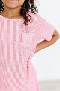 girls pink scrunchy pocket tee with textured fabric and short sleeves