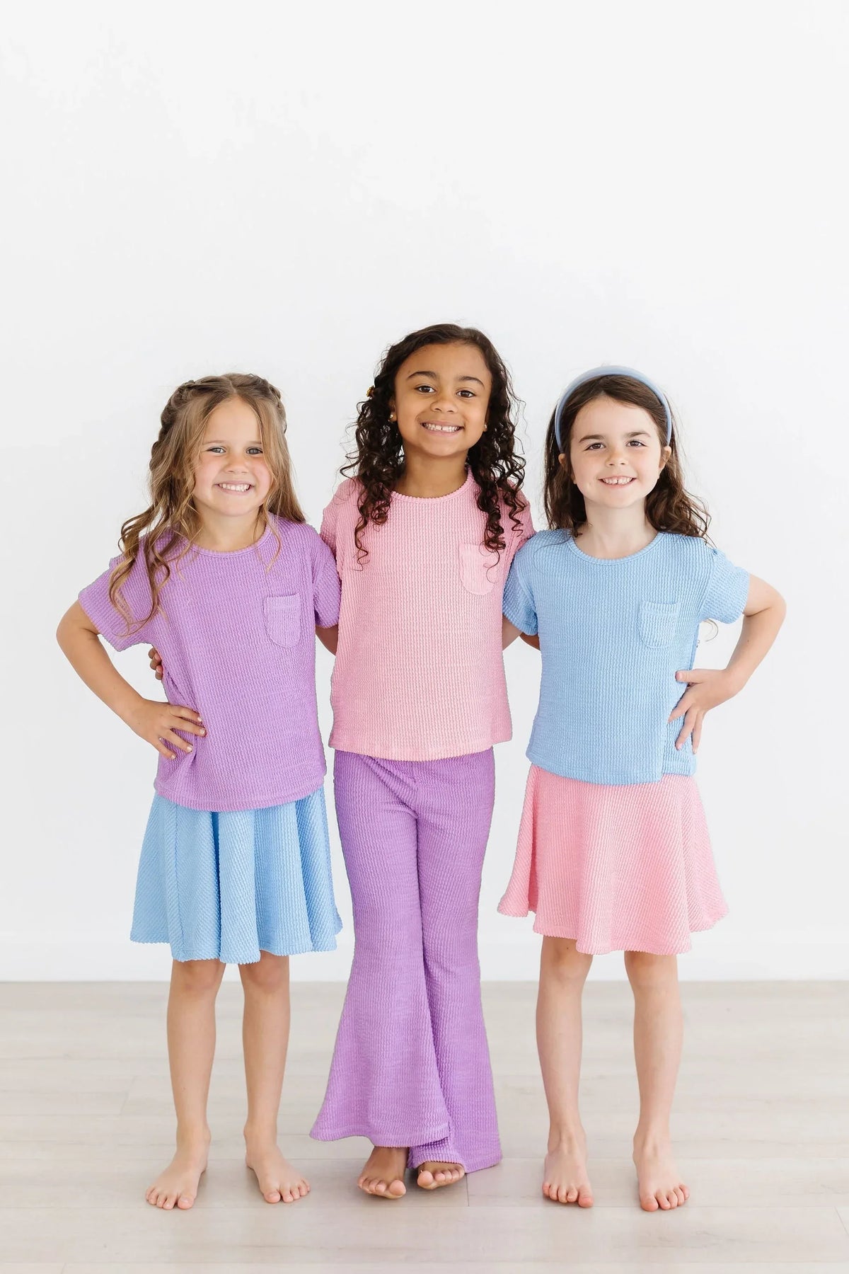 Girls pocket tee in pastel purple pink and blue with scrunchy fabric detail and casual fit