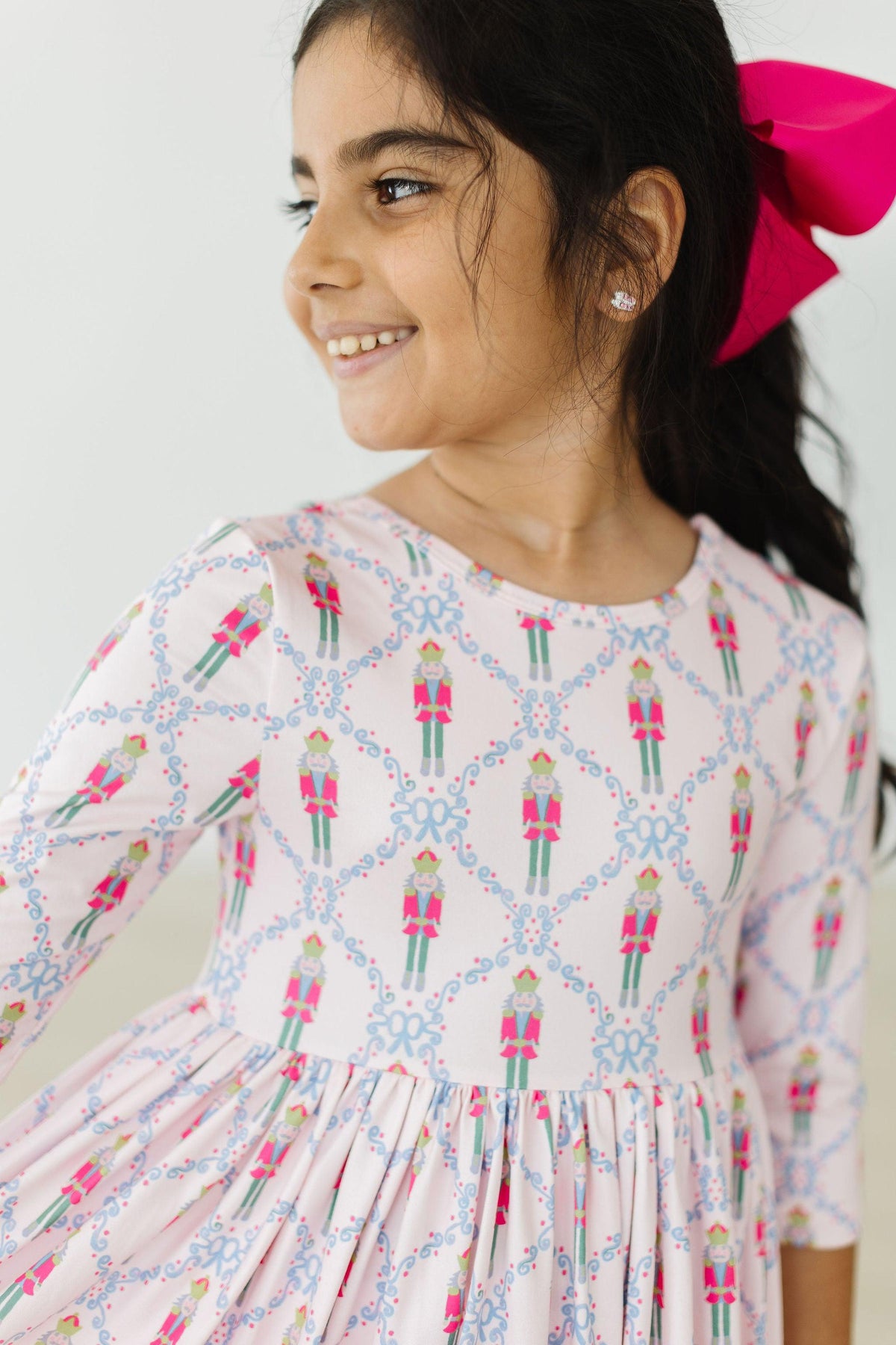 Girls light pink pocket twirl dress for girls with nutcracker print and sleeves