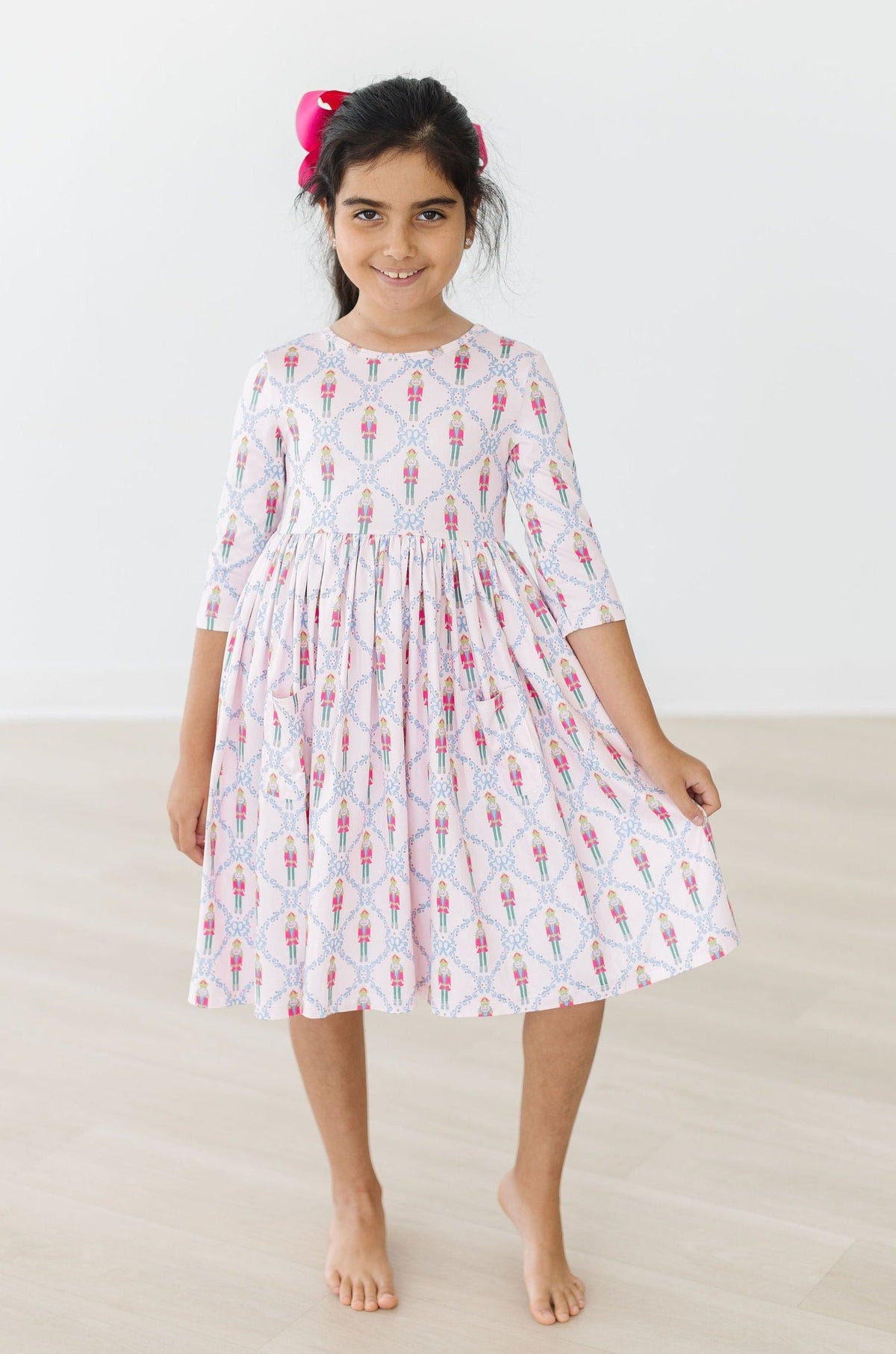 girls white pocket twirl dress for girls with pink and blue pattern 3 quarter sleeves