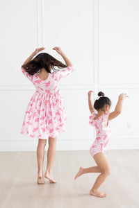 Girls pink pocket twirl dress and matching pink ruffle swimsuit for toddlers and kids