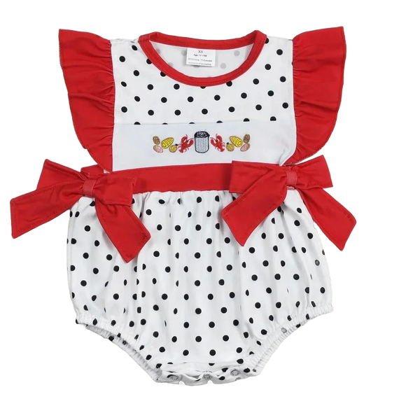 Baby girls white and black polka dot summer romper with red ruffle sleeves and bow details