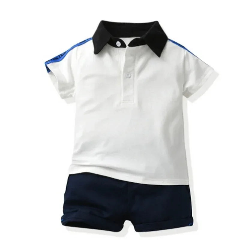 boys white and black collar polo shorts set with blue stripe detailing short sleeve for toddlers